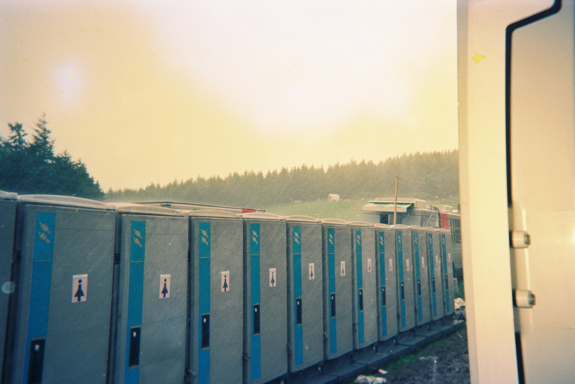 Blue portable toilet facility in public space